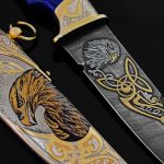 Drawing Damascus steel knife with gold coating and scabbard