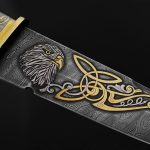 Pattern Damascus steel knife with gold applied