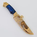 Damascus steel hunting knife with blue handle and eagle sheath