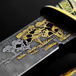 Damascus steel knife blade with slots through
