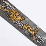 Damascus steel blade depicting a leopard chasing prey