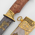 gold knife with scabbard