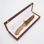 gift wooden box with golden knife