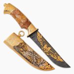 Knife with a wooden handle and a golden sheath with the image of a bear