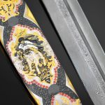 The blade of the dagger is made of Damascus steel, the scabbard is decorated with an ornament of gold and enamel with the addition of cubic zirkonia and the image of a rider