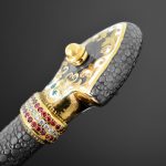 The handle of the dagger is decorated with gold, cubic zirconias and enamel ornaments