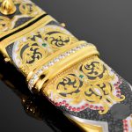 The scabbard is decorated with an ornament of gold and enamel with the addition of cubic zirkonia