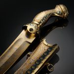 Dagger handle and scabbard of gold with green cubic zirconia and enameled ornaments