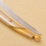 golden scabbard and damasscus blade