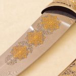 gold engraving on Damascus steel