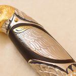 Knife handle in the shape of a falcon