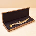 gold knife in a gift box
