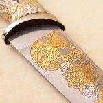 gold engraving on Damascus steel